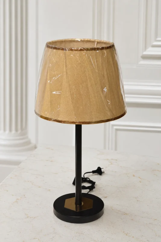 Modern black metal table lamp with a beige fabric lampshade, perfect for bedside tables, living rooms, offices, and contemporary home décor