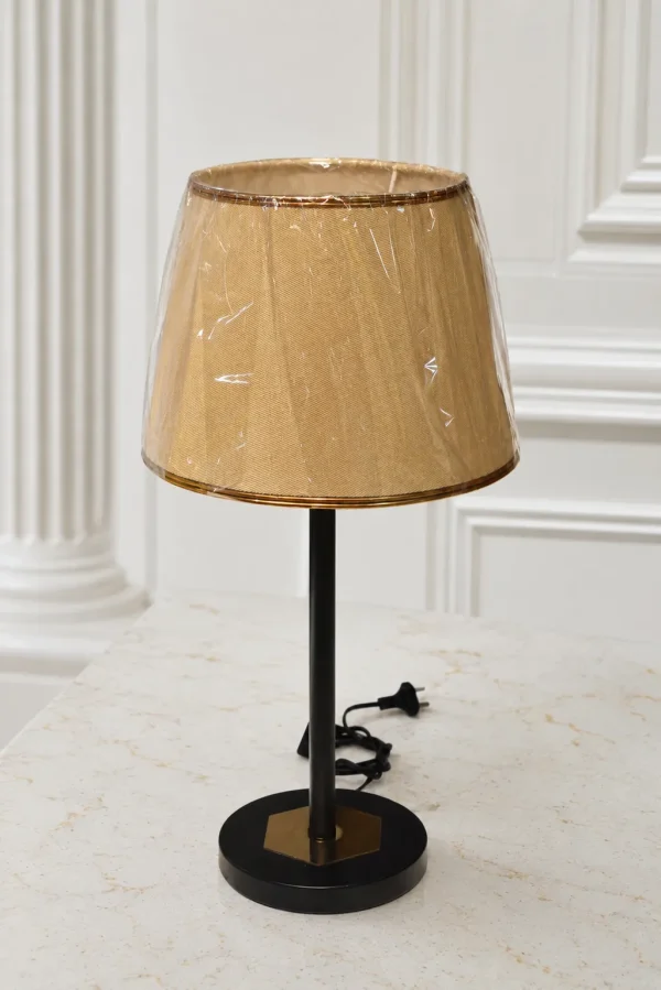 Modern black metal table lamp with a beige fabric lampshade, perfect for bedside tables, living rooms, offices, and contemporary home décor