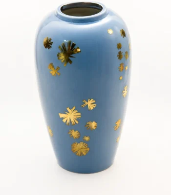 Glossy blue ceramic vase with metallic gold starbursts