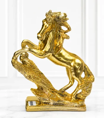 Luxury golden rearing horse decorative showpiece with a textured base for modern home and office décor.