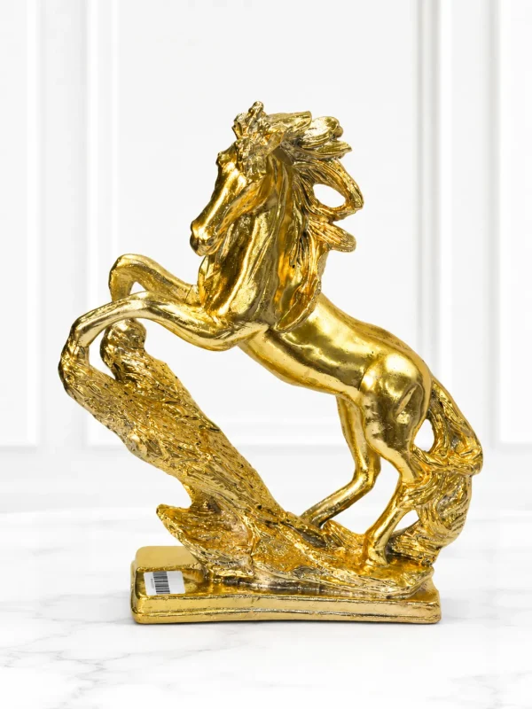 Luxury golden rearing horse decorative showpiece with a textured base for modern home and office décor.