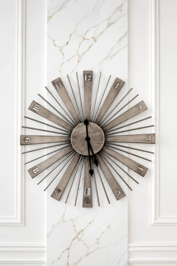 Modern sunburst metal wall clock with brushed metallic finish