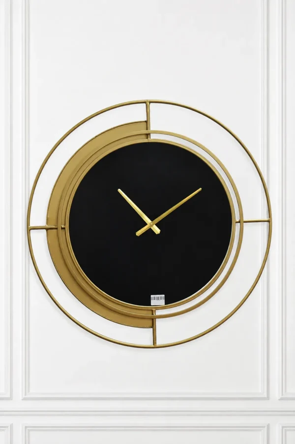 Modern black and gold wall clock with minimalist dial