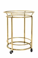 Modern round gold bar cart featuring a two-tier cylindrical frame with clear glass shelves and black rolling caster wheels on a solid white background.