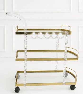Premium acrylic and gold 3-tier bar cart featuring twisted lucite support pillars, transparent glass shelves, a curved handle, and rolling caster wheels