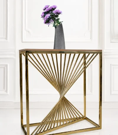 Modern gold geometric console table featuring a twisted spiral rod base and a wood top holding a grey vase with purple flowers.