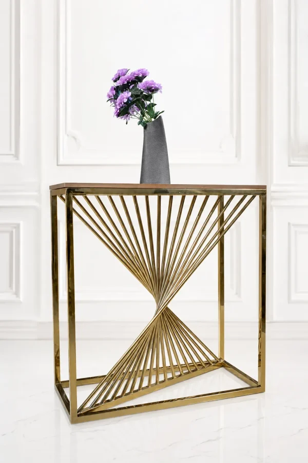 Modern gold geometric console table featuring a twisted spiral rod base and a wood top holding a grey vase with purple flowers.