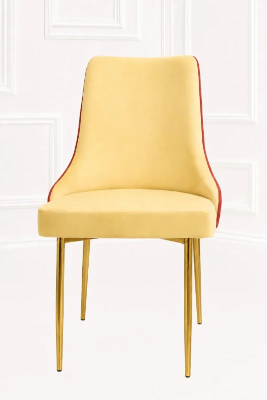 Modern yellow velvet dining chair from featuring a two-tone yellow and red upholstered frame supported by polished gold metal legs.