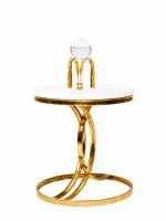 A luxury round white accent table featuring a thick polished gold rim and an artistic intertwining gold twist base on a solid white background.