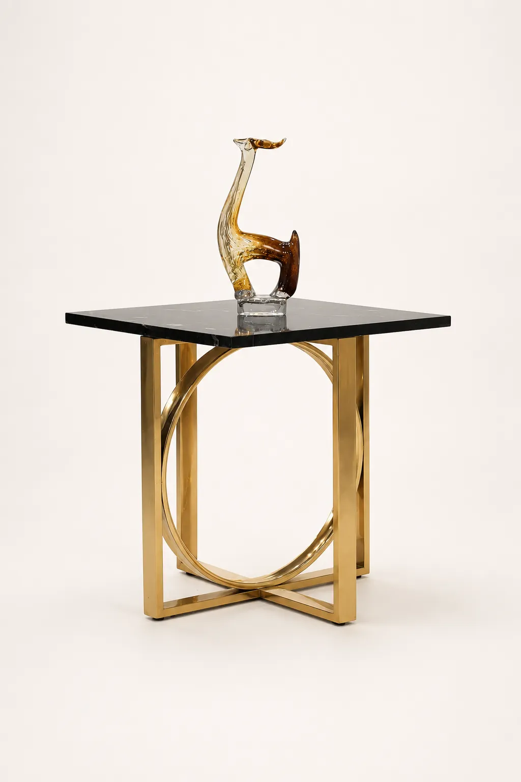 Luxury Square Black Accent Table with Polished Gold Geometric Ring Base Contemporary square black accent table featuring a polished gold stainless steel geometric ring base frame with a decorative glass sculpture on top,