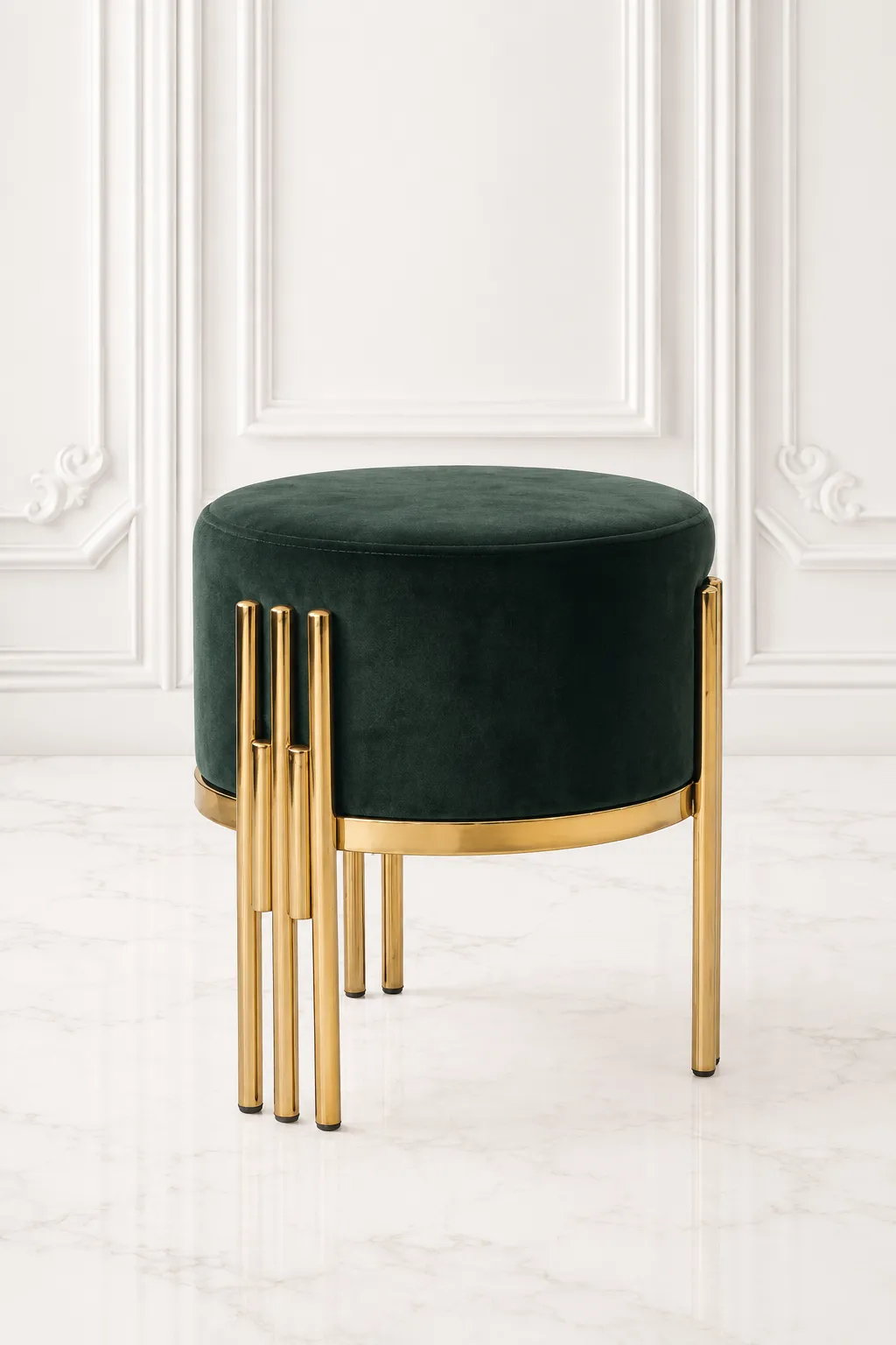 Modern Emerald Green Velvet Vanity Stool with Tiered Gold Tubular Legs Round emerald green velvet vanity stool featuring a plush cushioned seat and modern tiered gold tubular legs, placed against an elegant white wall paneling background.