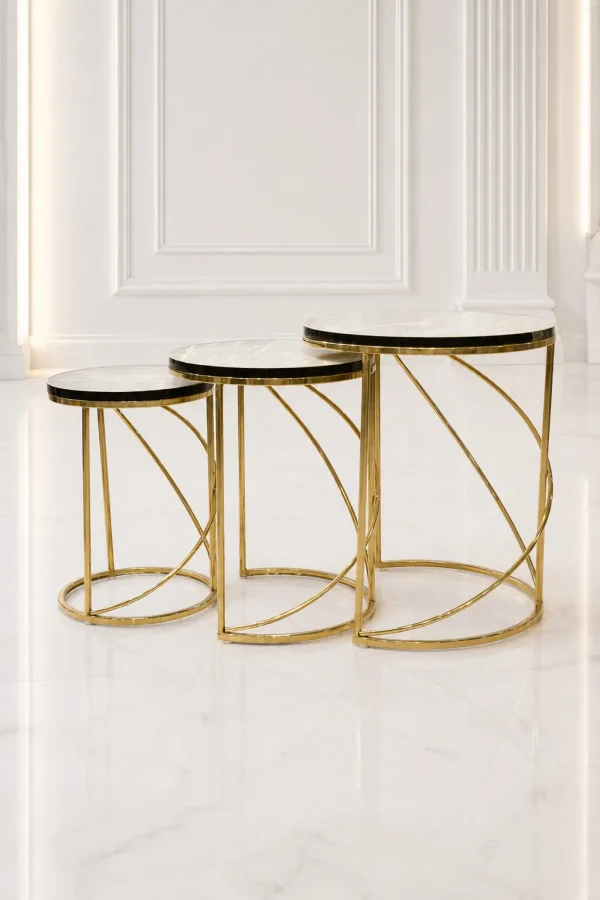 Set of three luxury round marble nesting tables with gold spiral base arranged in a staggered, descending layout