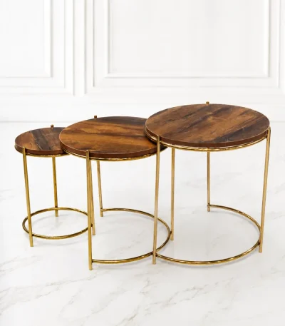 Set of three luxury round rustic wood nesting tables with gold frame arranged in a staggered, descending layout