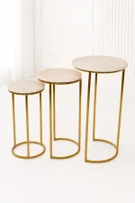 Set of three luxury round marble nesting tables with gold frame arranged in a staggered, descending layout,