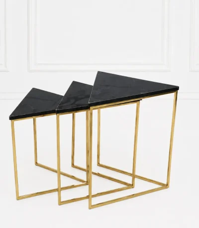 Set of three luxury triangular black marble nesting tables with gold frame arranged in a tiered, descending layout