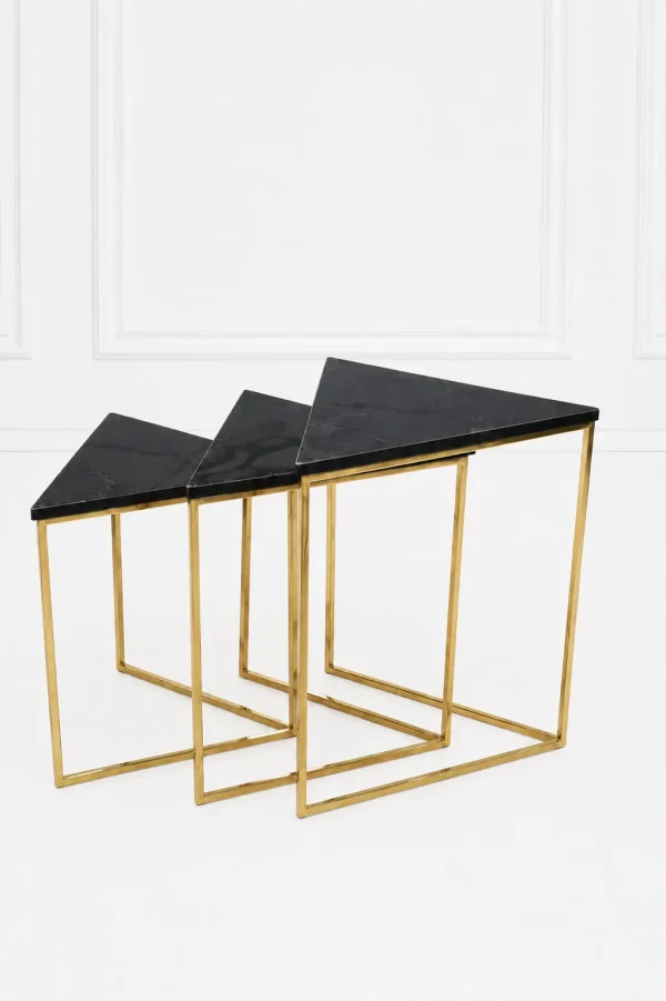 Set of three luxury triangular black marble nesting tables with gold frame arranged in a tiered, descending layout