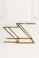 Set of two luxury square white marble nesting tables with gold z base arranged in a nested, staggered layout
