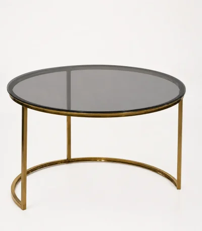 Luxury round smoked glass coffee table with gold crescent base featuring a dark tinted glass top and an open semi-circular metal foundation