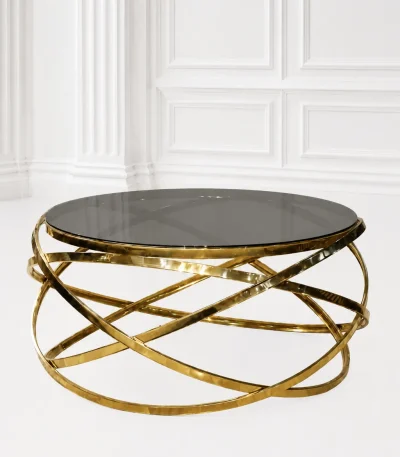 Luxury round smoked glass coffee table with gold infinity base featuring a dark tinted glass top and an interlocking orbital ribbon frame