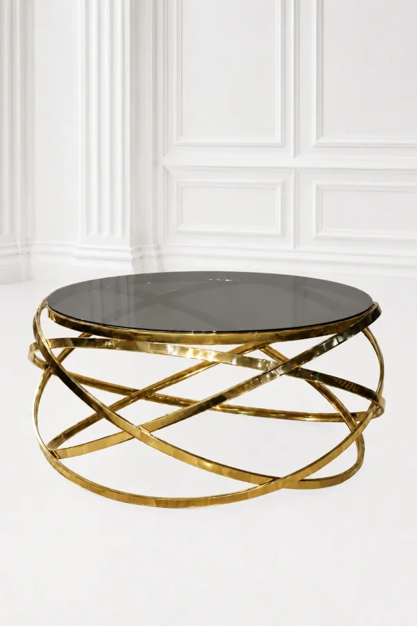 Luxury round smoked glass coffee table with gold infinity base featuring a dark tinted glass top and an interlocking orbital ribbon frame