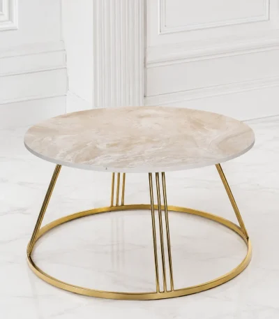 Luxury round marble top coffee table with gold tapered frame featuring a cream-beige veined top and multi-rod metallic leg clusters