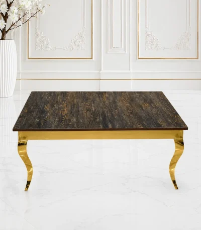 Luxury square rustic wood coffee table with gold cabriole legs featuring a dark charred wood grain top and curved s-shape metal legs