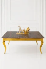 Luxury square dark wood coffee table with gold cabriole legs featuring a textured dark wood top styled with a gold horse sculpture