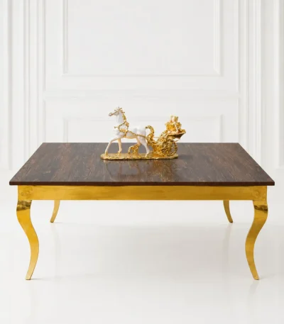Luxury square dark wood coffee table with gold cabriole legs featuring a textured dark wood top styled with a gold horse sculpture