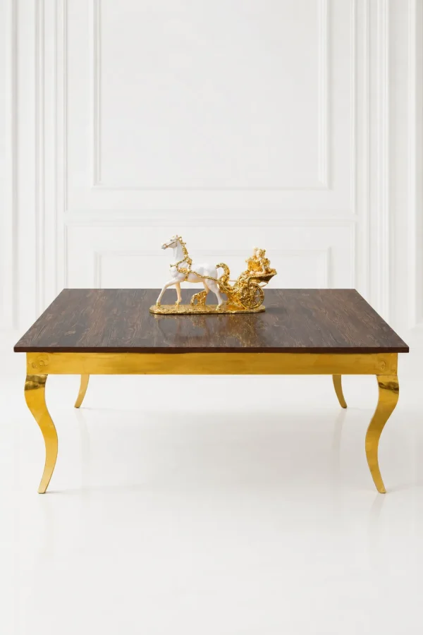 Luxury square dark wood coffee table with gold cabriole legs featuring a textured dark wood top styled with a gold horse sculpture