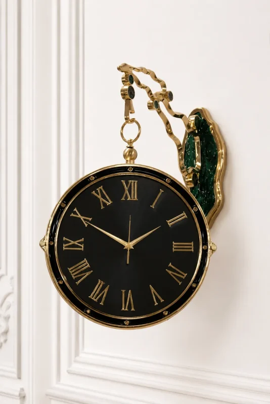Luxury double sided hanging wall clock with gold Roman numerals, featuring a matte black face and a decorative gold bracket with a malachite green mount,