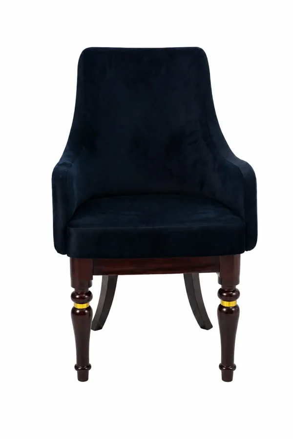 Luxury black velvet armchair featuring sloped armrests and sculpted dark wood legs with integrated polished gold ring accents, shown against a plain white background.