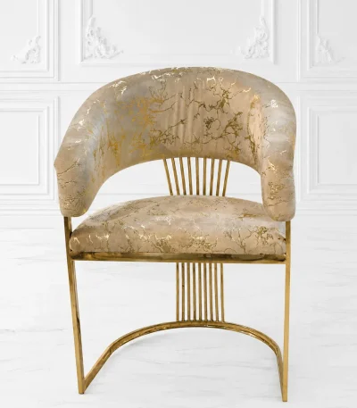 Luxury barrel accent chair with a metallic gold marble pattern fabric, supported by a polished gold stainless steel frame featuring vertical back slats and a curved base.