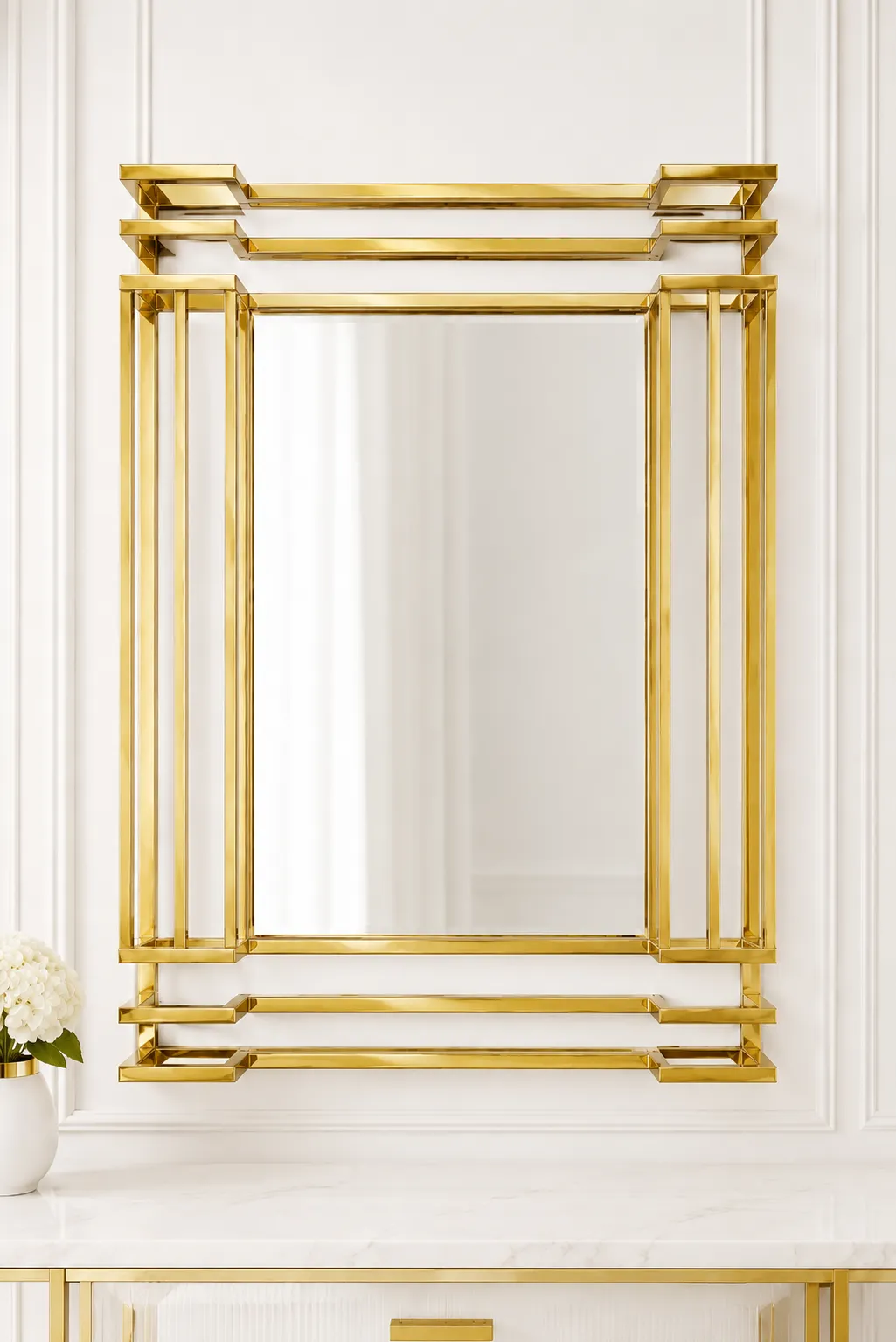 Luxury Art Deco Rectangular Gold Wall Mirror – Tiered Stainless Steel Accent Mirror Luxury rectangular gold wall mirror with a tiered three-dimensional stainless steel frame hanging above a white marble console table.