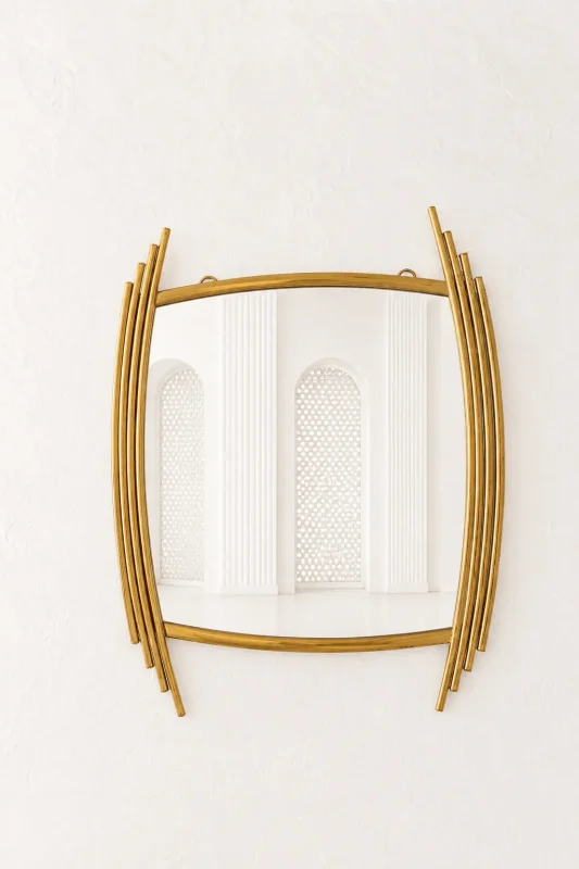 Luxury asymmetric gold wall mirror with an abstract barrel shape and staggered stainless steel side rods mounted on a textured white wall.