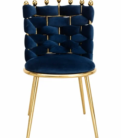Front view of a luxury navy blue velvet dining chair featuring a unique woven brick-pattern backrest topped with gold spherical finials and supported by polished gold legs.
