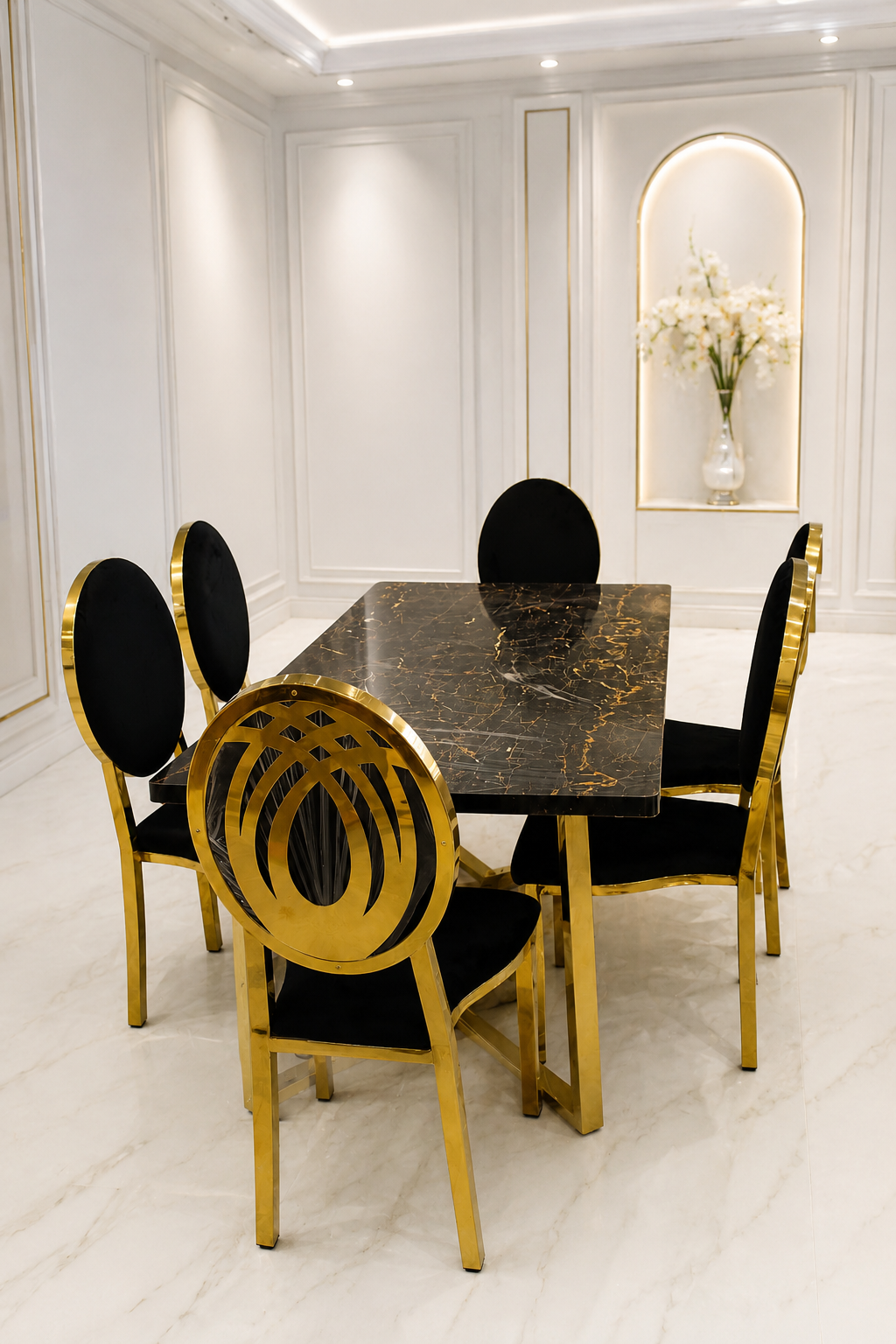 Modern Luxury Black Marble Dining Table and Velvet Chair Set A luxury dining room set featuring a rectangular black marble table with gold veining and black velvet chairs with gold-finished circular metal frames.