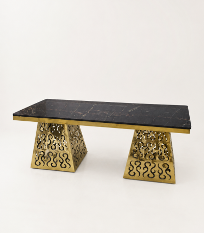 A luxury rectangular console table featuring a polished black marble top and two ornate, laser-cut gold-finished metal bases.