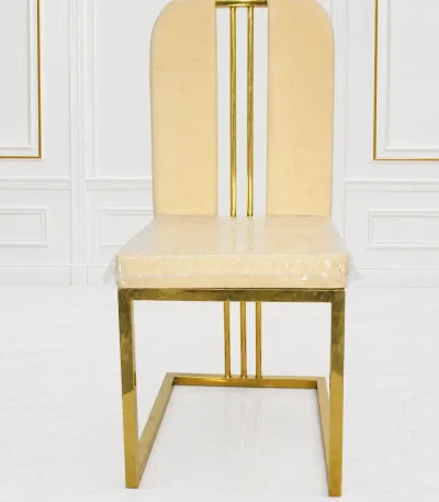 Luxury cream velvet dining chair with gold stainless steel frame.