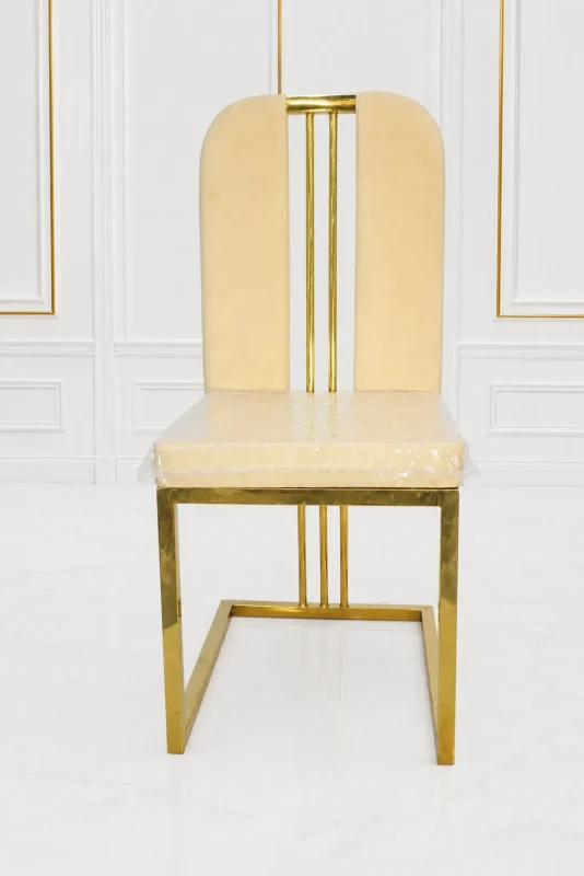 Luxury cream velvet dining chair with gold stainless steel frame.