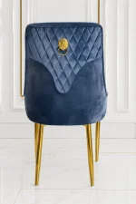 Premium upholstered dining chair with diamond stitching and decorative gold handle.
