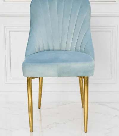 Light grey velvet dining chair with gold metal legs and stitched fan backrest.