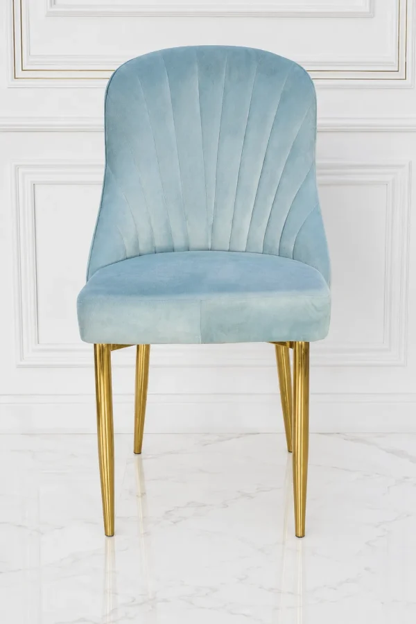 Light grey velvet dining chair with gold metal legs and stitched fan backrest.