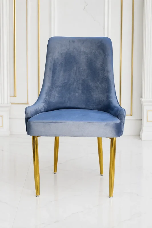 Modern quilted velvet dining chair featuring gold legs for elegant home interiors.