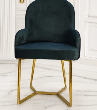 Luxury black velvet arm dining chair with gold stainless steel geometric base for modern dining rooms.