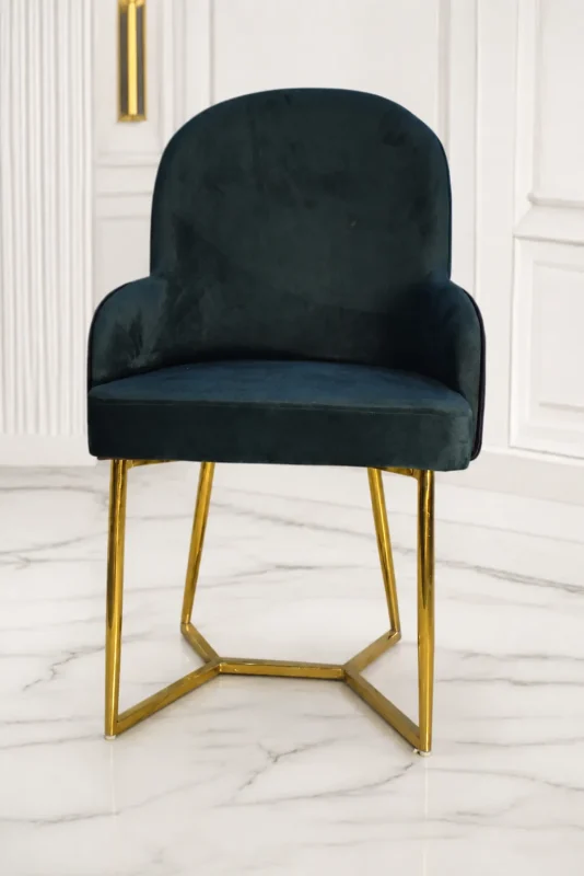 Luxury black velvet arm dining chair with gold stainless steel geometric base for modern dining rooms.