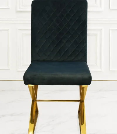 Luxury black velvet dining chair with diamond quilted back and gold stainless steel sled base.