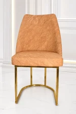 Luxury beige velvet dining chair with gold stainless steel sled base for modern dining rooms.