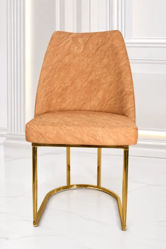 Luxury beige velvet dining chair with gold stainless steel sled base for modern dining rooms.