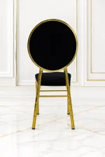 Premium stainless steel gold banquet chair featuring black velvet upholstery for luxury event venues.