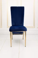 Luxury navy blue velvet dining chair with gold metal legs for modern dining rooms and hotels.
